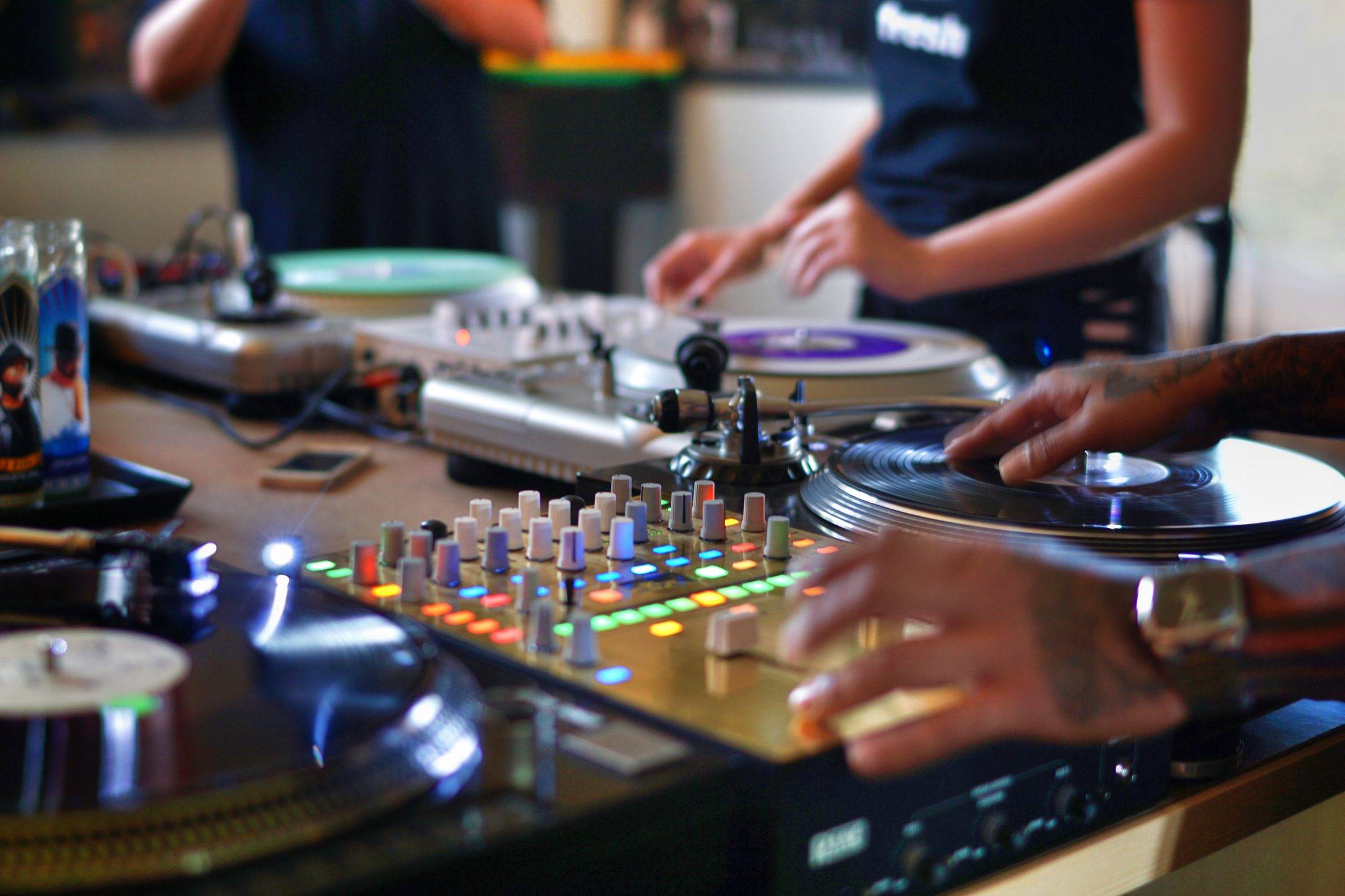 DJs mixing records together